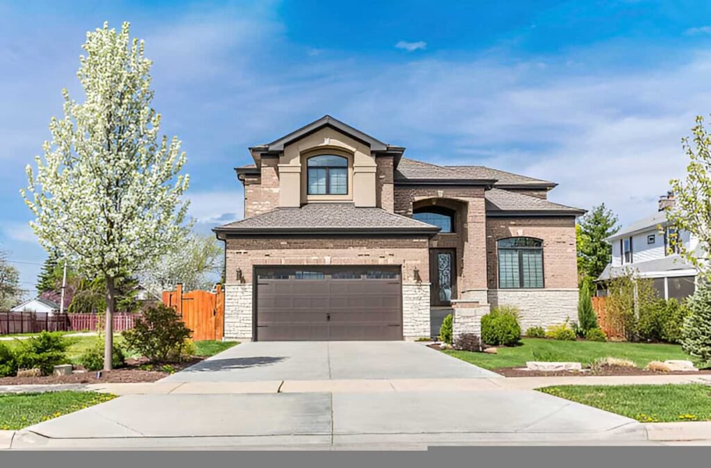 Modern two-story home with a brick facade, large windows, and a landscaped front yard, situated in Greenacres Place, LA, representing quick home buying services by Sell My House Pro.